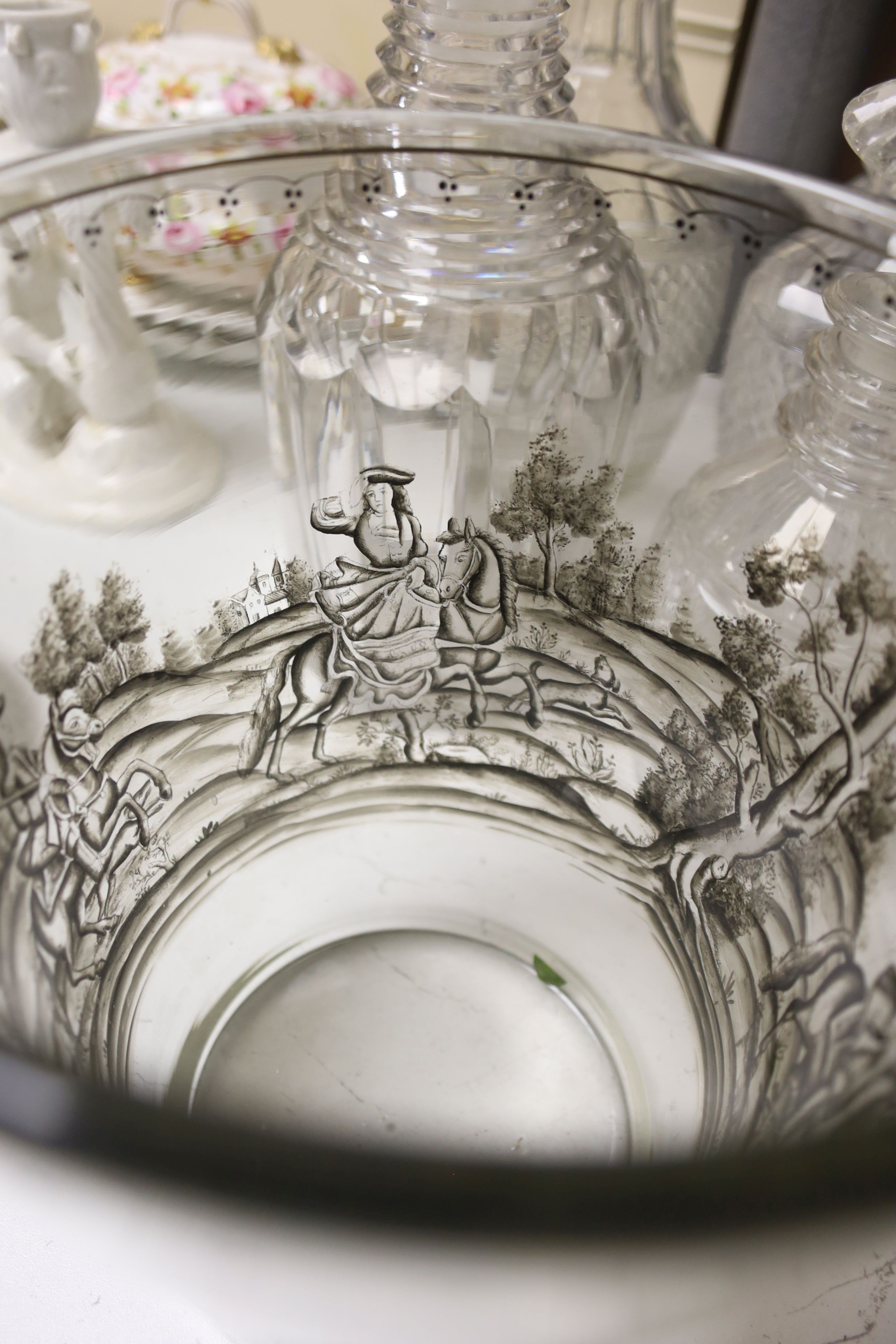 A glass vase with enamelled hunting scene with sundry decanters